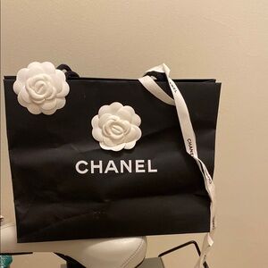 Chanel Black Paper Shopping Bag with White Floral Accents
